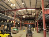 interior of rear warehouse with mezzanie and hig clearance ceilings