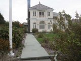 view from walkway to water with flag pole