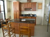 complete kitchen with granite island and countertop